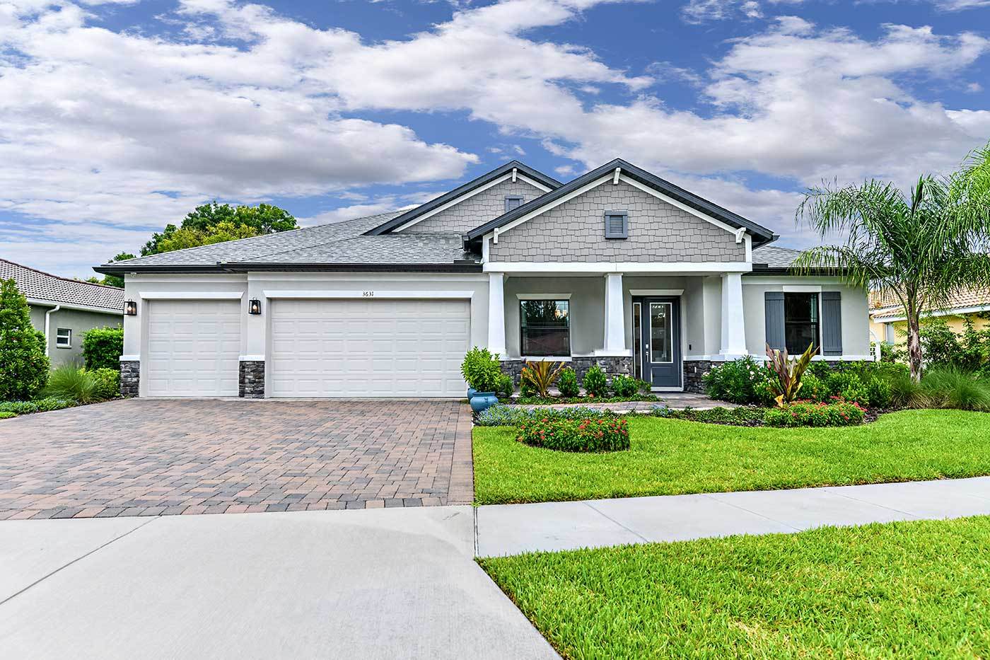Joyce craftsman elevation with opt stone La Paloma model home William Ryan Homes Tampa