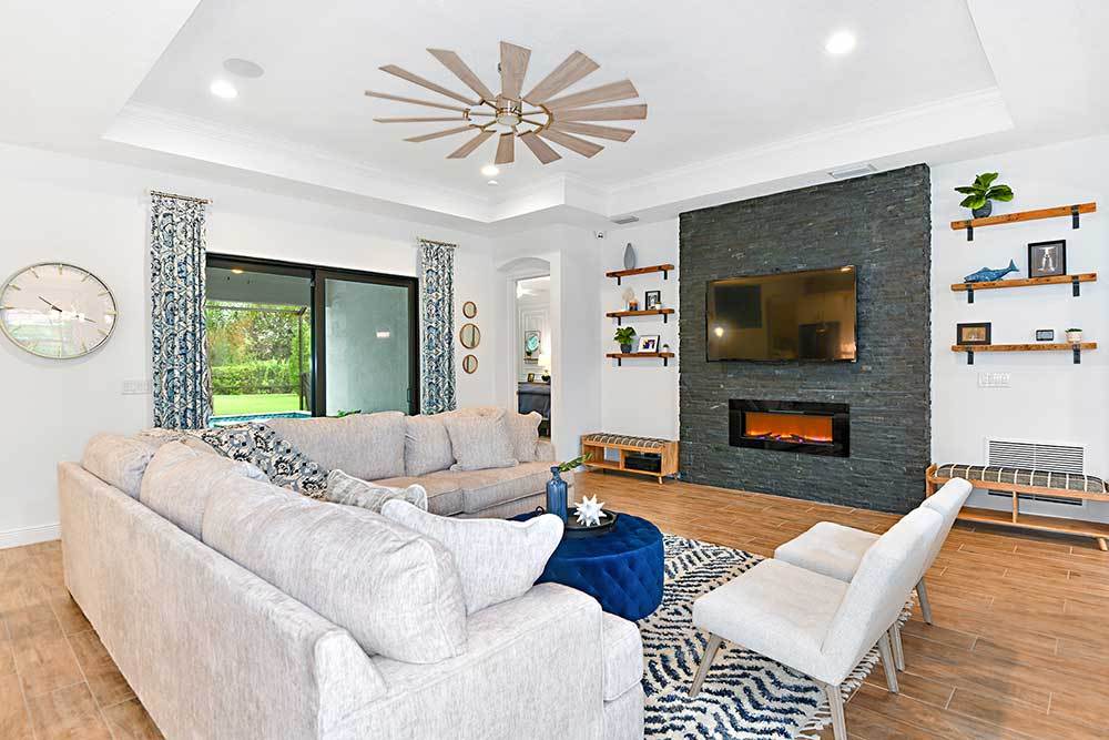 Joyce model home great room with access to covered lanai by William Ryan Homes Tampa