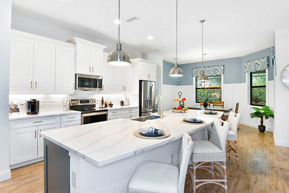 Joyce model home large kitchen with connected breakfast area by William Ryan Homes Tampa