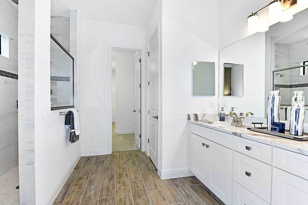 Joyce model home owners bathroom with walk in shower and dual sink vanity William Ryan Homes Tampa