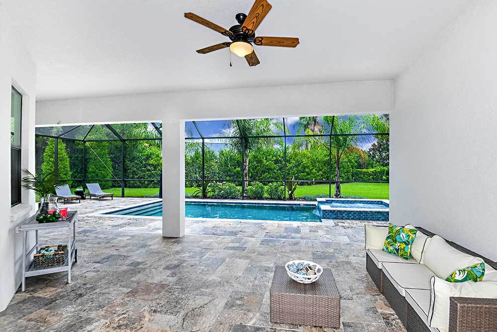 Joyce model home extended covered lanai option plus an added pool by William Ryan Homes Tampa