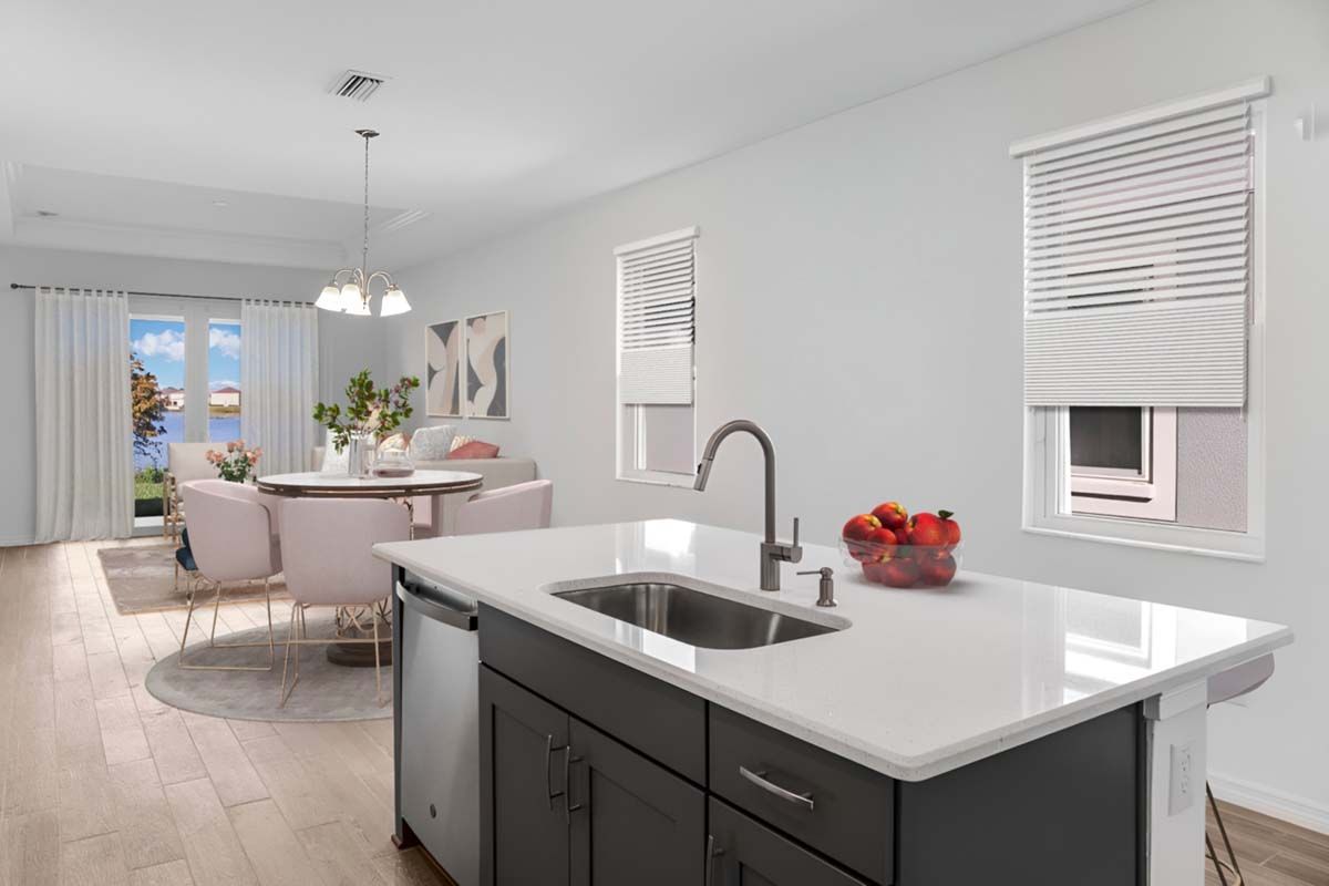 Flora model new home for sale by William Ryan Homes Ft Myers kitchen and living room