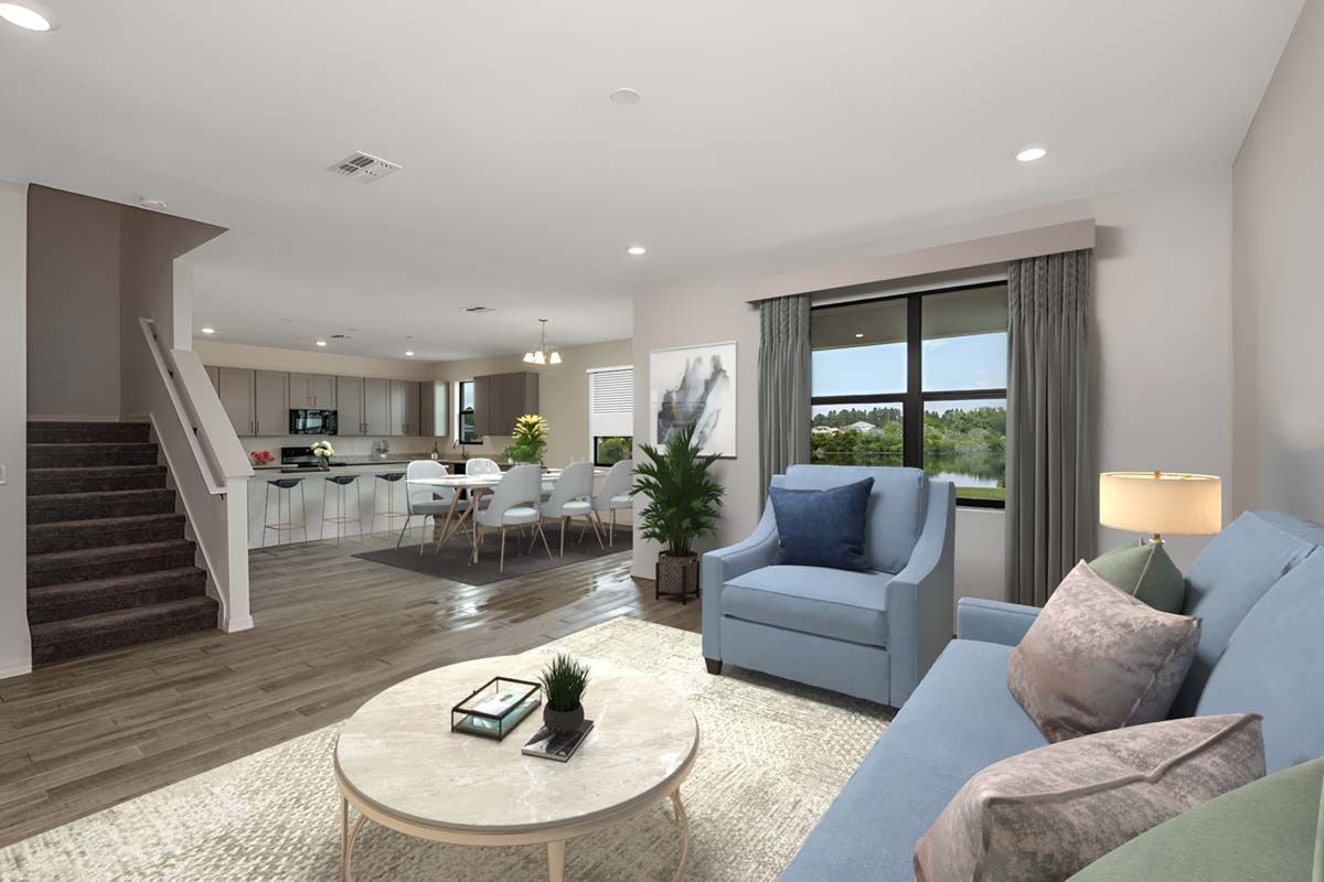Juniper home plan view of family room into kitchen and dining area William Ryan Homes Tampa