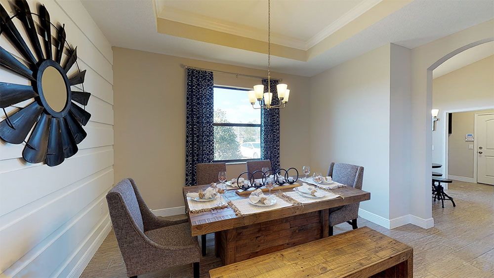 Sweetwater model home plan separate dining room with tray ceiling options by William Ryan Homes Tampa