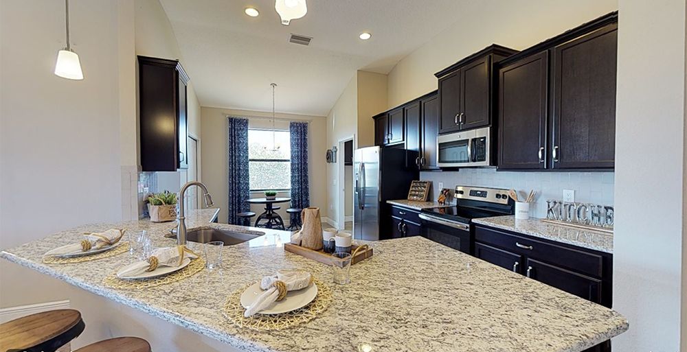 Sweetwater model home granite countertops by William Ryan Homes Tampa
