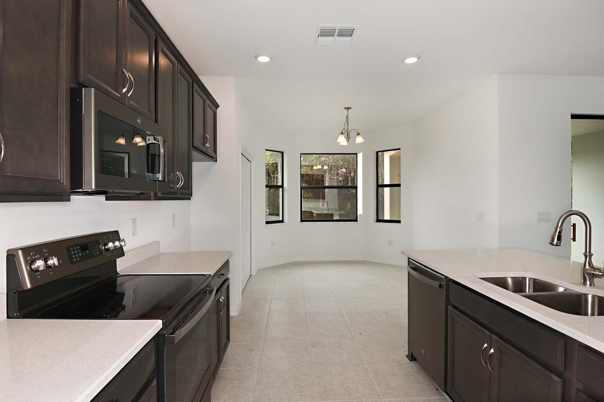 Juno home plan kitchen view to café with optional bay window William Ryan Homes Tampa 