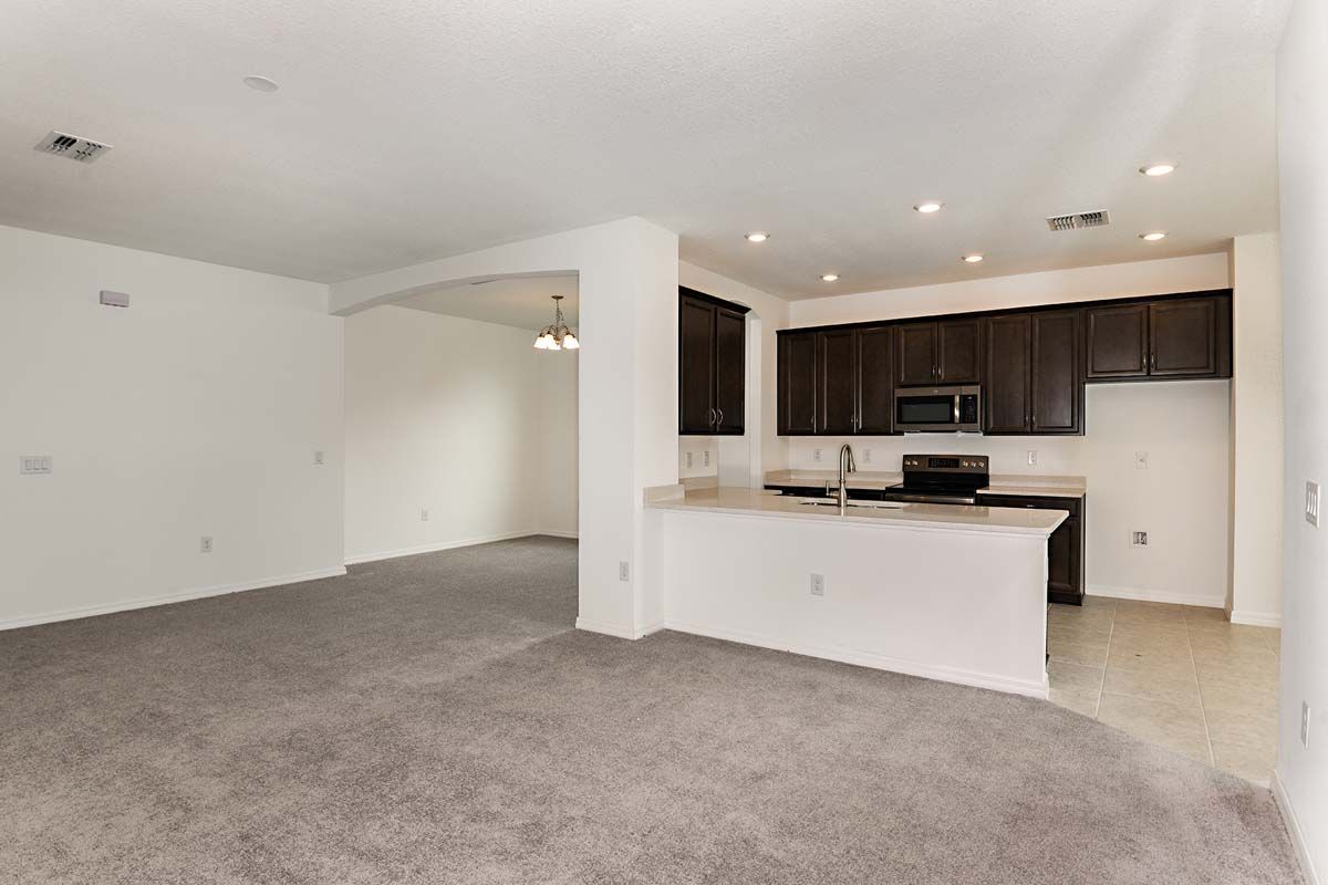 Juno home plan great room view to kitchen and dining room William Ryan Homes Tampa