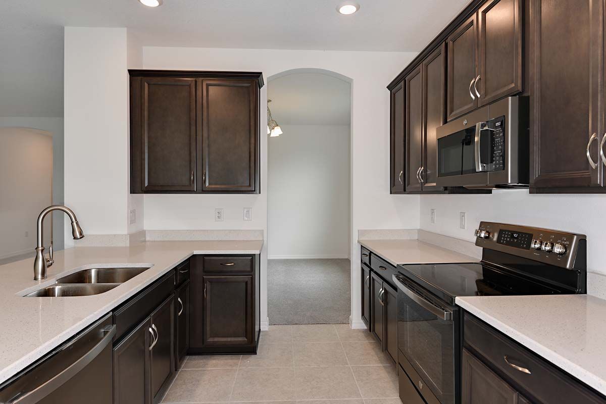 Juno home plan kitchen view to dining room William Ryan Homes Tampa