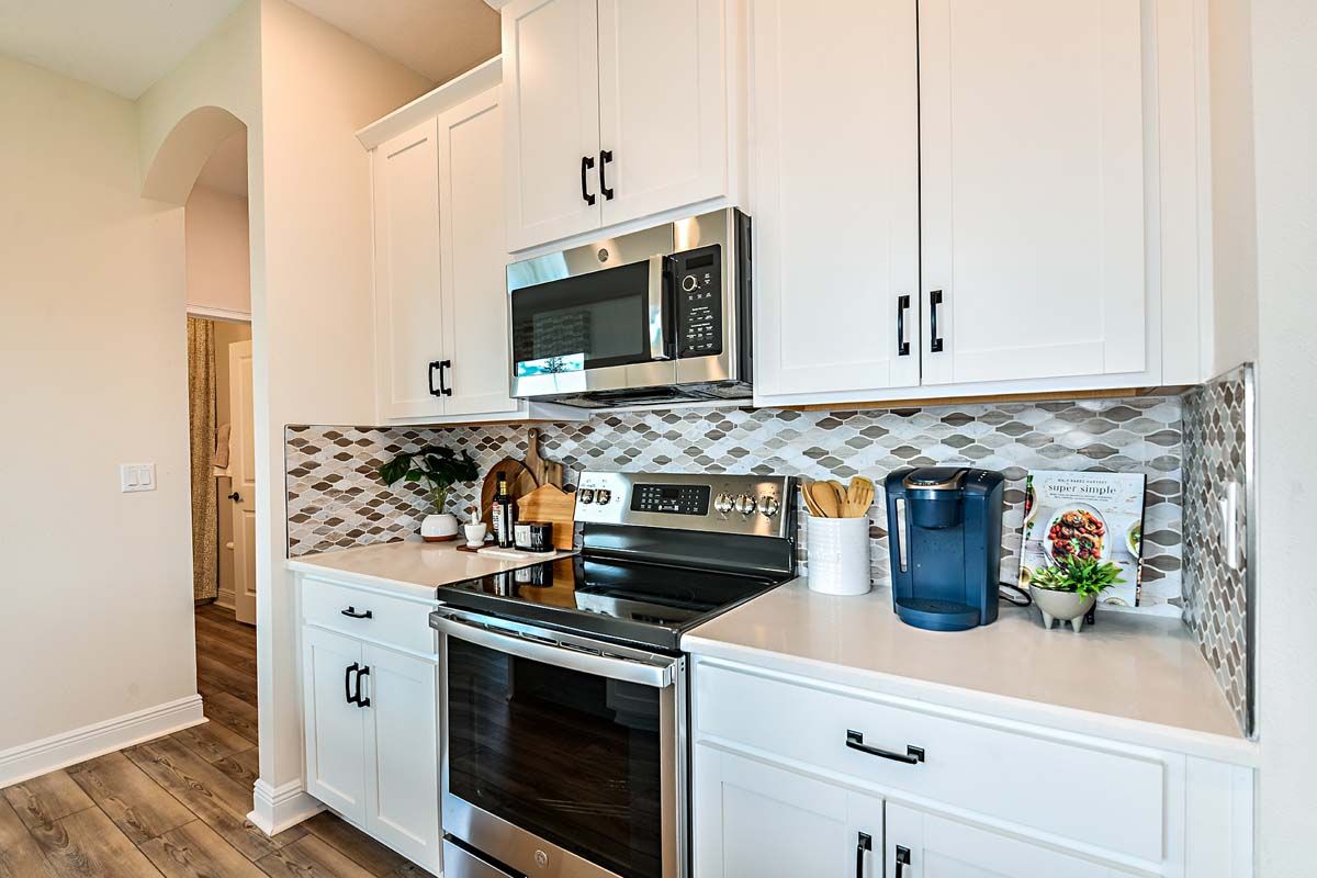 Cypress model new home for sale by William Ryan Homes Ft Myers kitchen with designer selections 