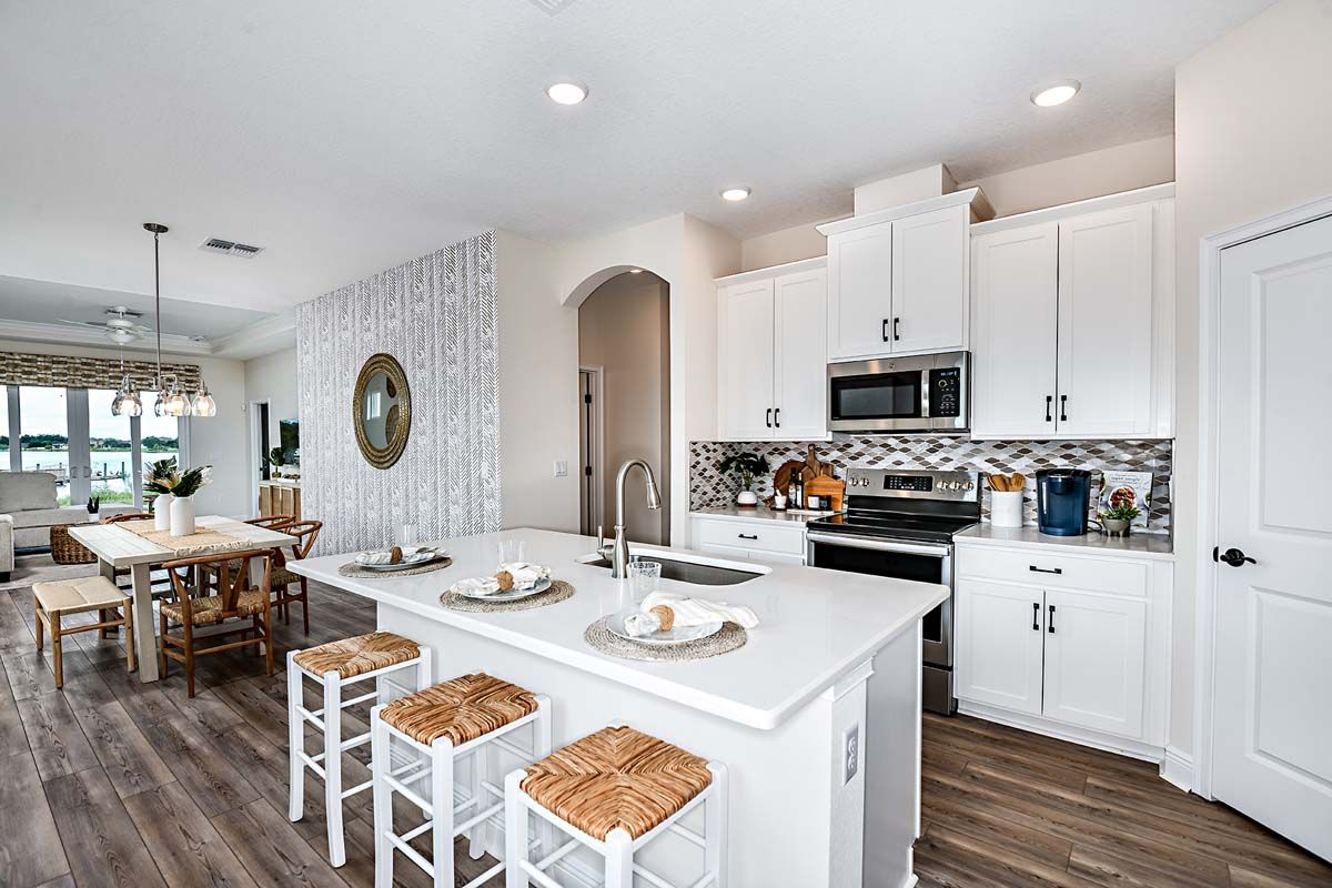 Cypress model new homes for sale at The Sanctuary at Babcock Ranch by William Ryan Homes Ft. Myers Kitchen Dining Area