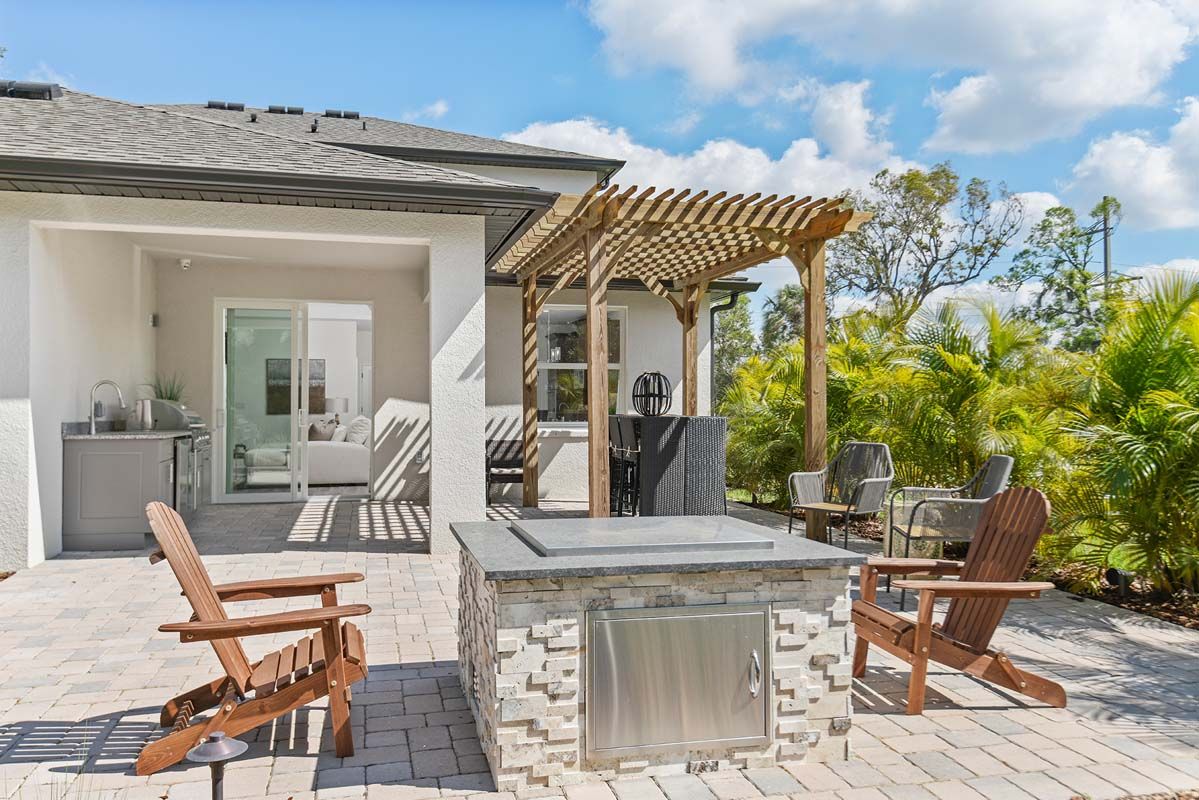 Sandalwood new home plan outdoor fire pit at Tea Olive Terrace by William Ryan Homes Tampa