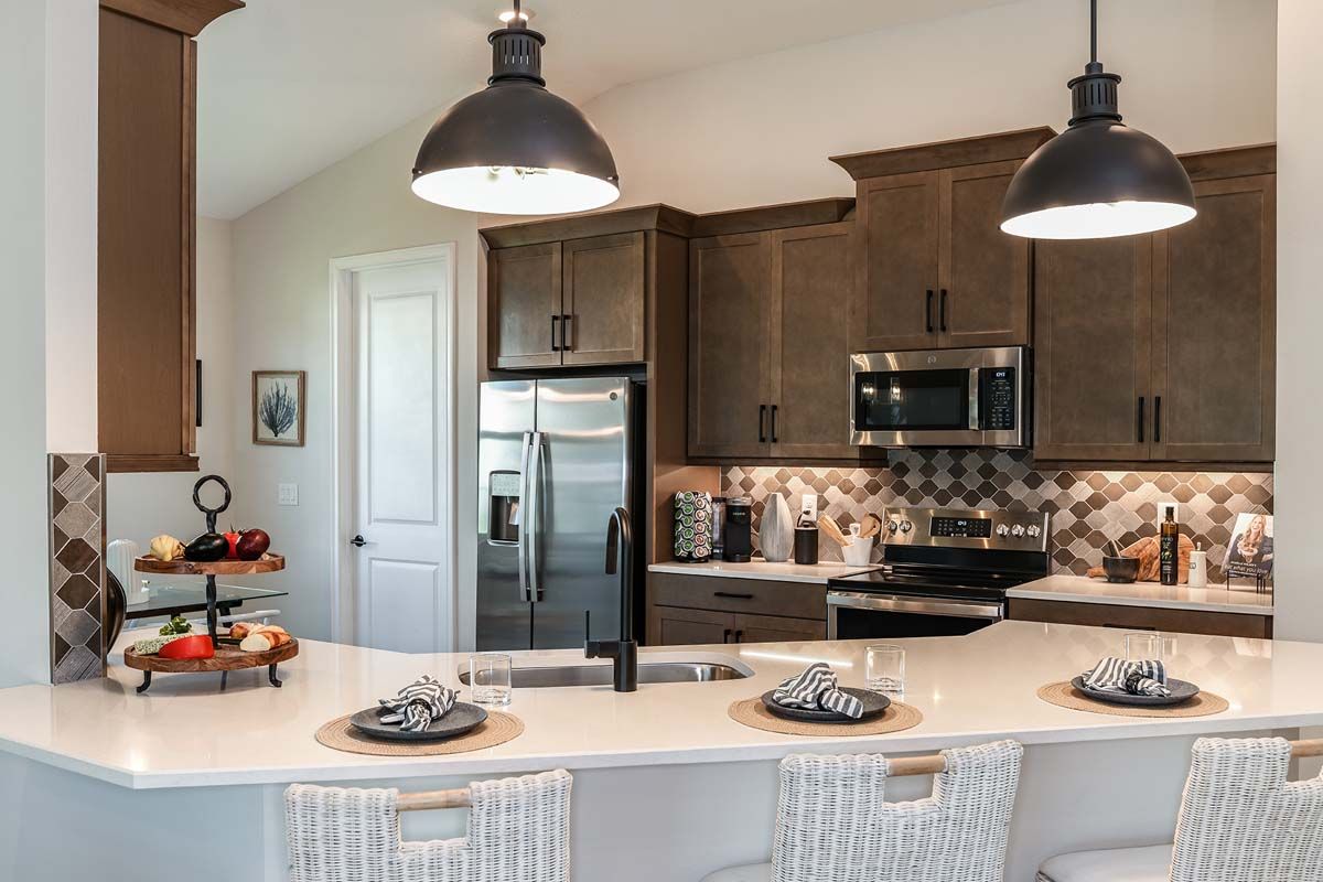 Sweetwater new construction home plan kitchen island area by William Ryan Homes Tampa