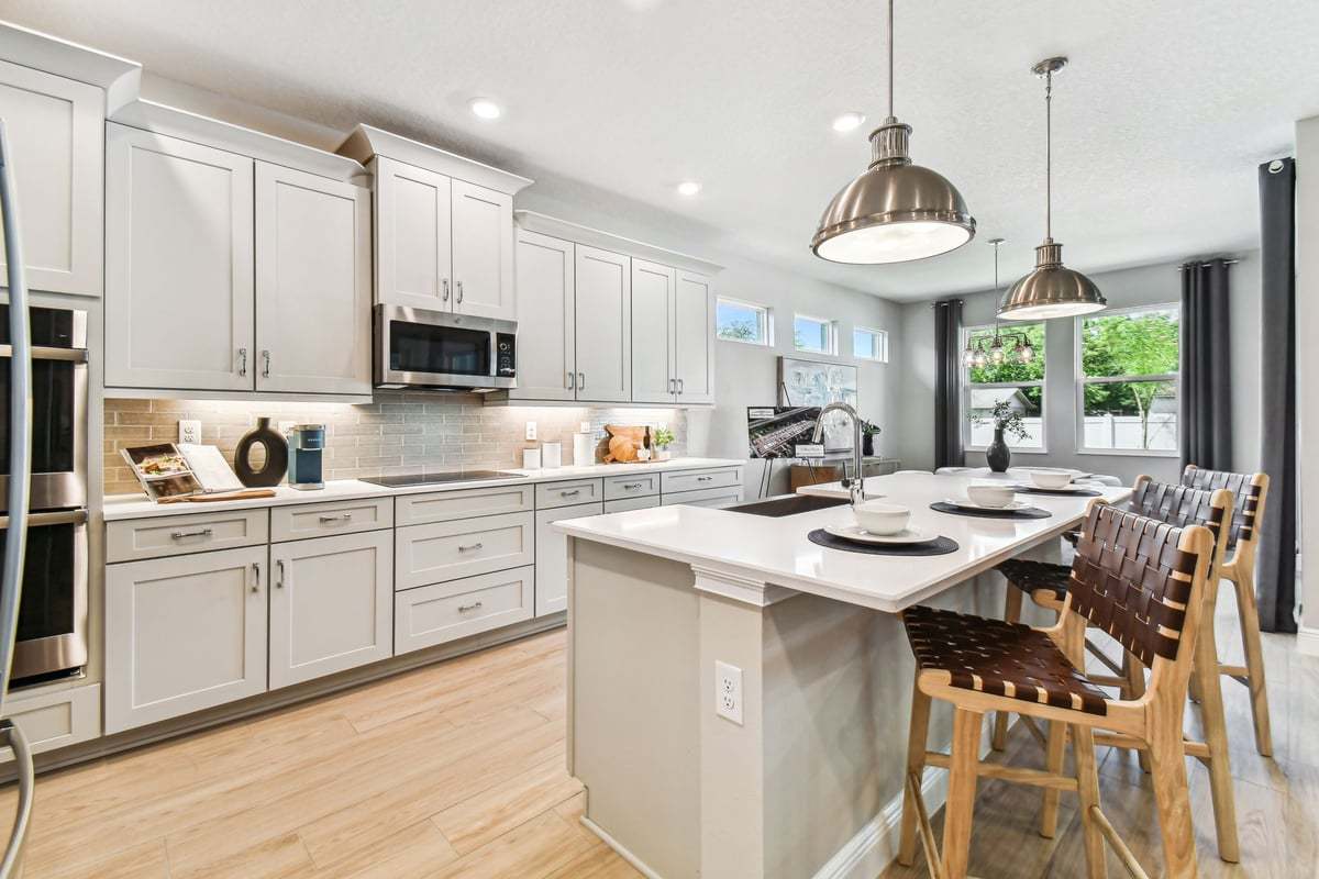 Charlotte new construction home plan open-concept living kitchen view by William Ryan Homes Tampa