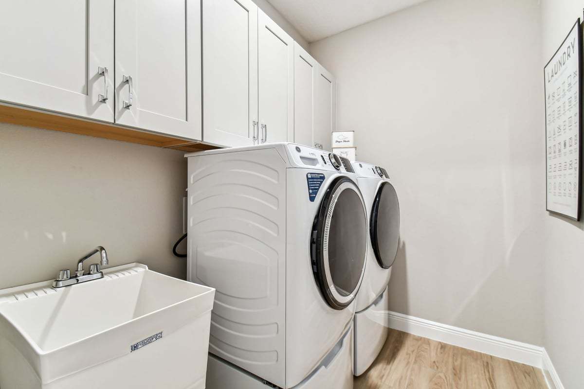Charlotte new construction home plan spacious laundry room interior by William Ryan Homes Tampa