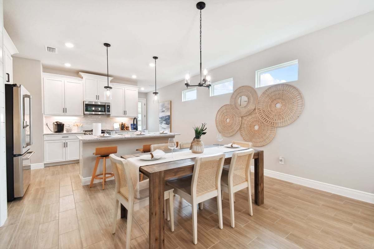 Sandpiper new construction luxury paired villa home plan cafe dining area in 55+ in Sun City Center, FL at Fairway Pointe by William Ryan Homes Tampa