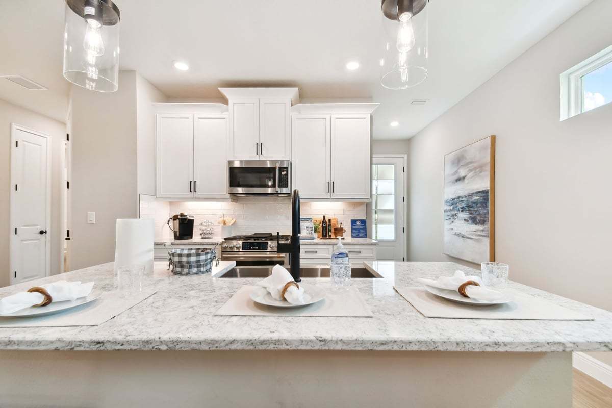 Sandpiper new construction luxury paired villa home plan large kitchen island in 55+ in Sun City Center, FL at Fairway Pointe by William Ryan Homes Tampa