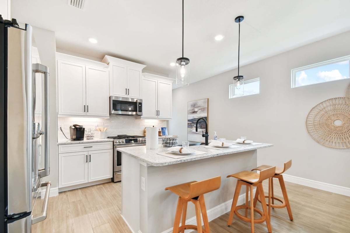 Sandpiper new construction luxury paired villa home plan large kitchen area in 55+ in Sun City Center, FL at Fairway Pointe by William Ryan Homes Tampa