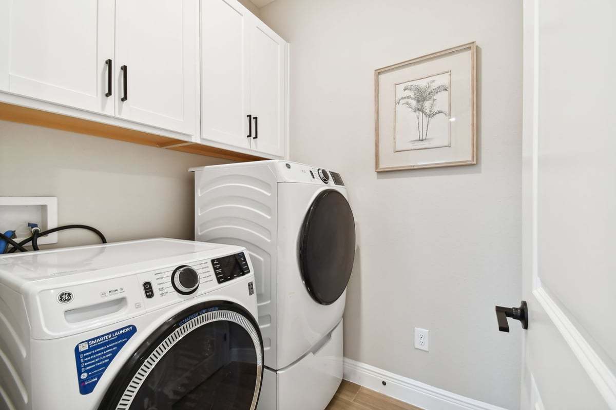 Sandpiper new construction luxury paired villa home plan interior laundry room in 55+ in Sun City Center, FL at Fairway Pointe by William Ryan Homes Tampa