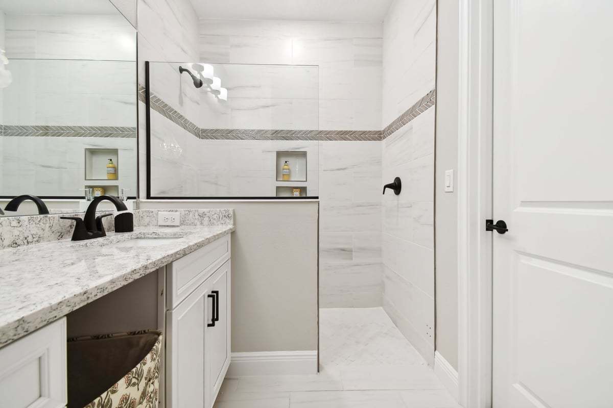 Sandpiper new construction luxury paired villa home plan owner's walk-in shower in 55+ in Sun City Center, FL at Fairway Pointe by William Ryan Homes Tampa