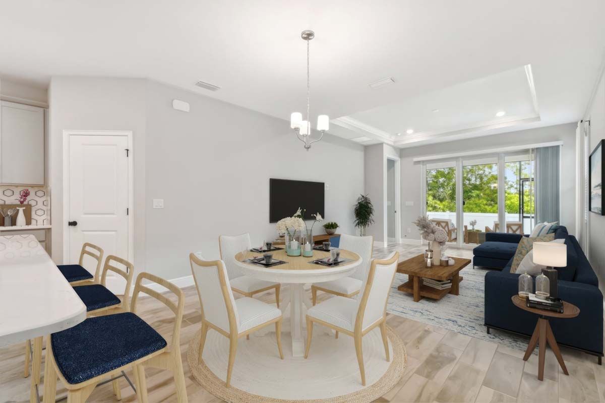 Jewel luxury new construction paired villa in Sun City Center, FL cafe dining and family room by William Ryan Homes Tampa