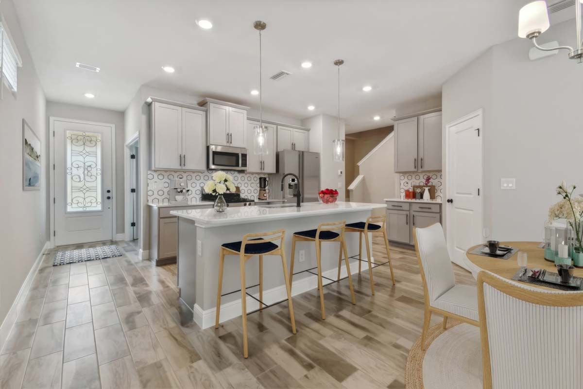 Jewel luxury new construction paired villa in Sun City Center, FL kitchen and cafe area by William Ryan Homes Tampa
