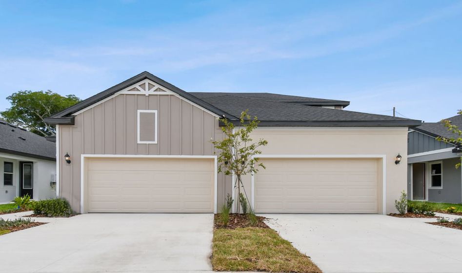 Jewel New construction Luxury Paired Villa - Farmhouse Elevation at Fairway Pointe in Sun City Center, FL by William Ryan Homes Tampa
