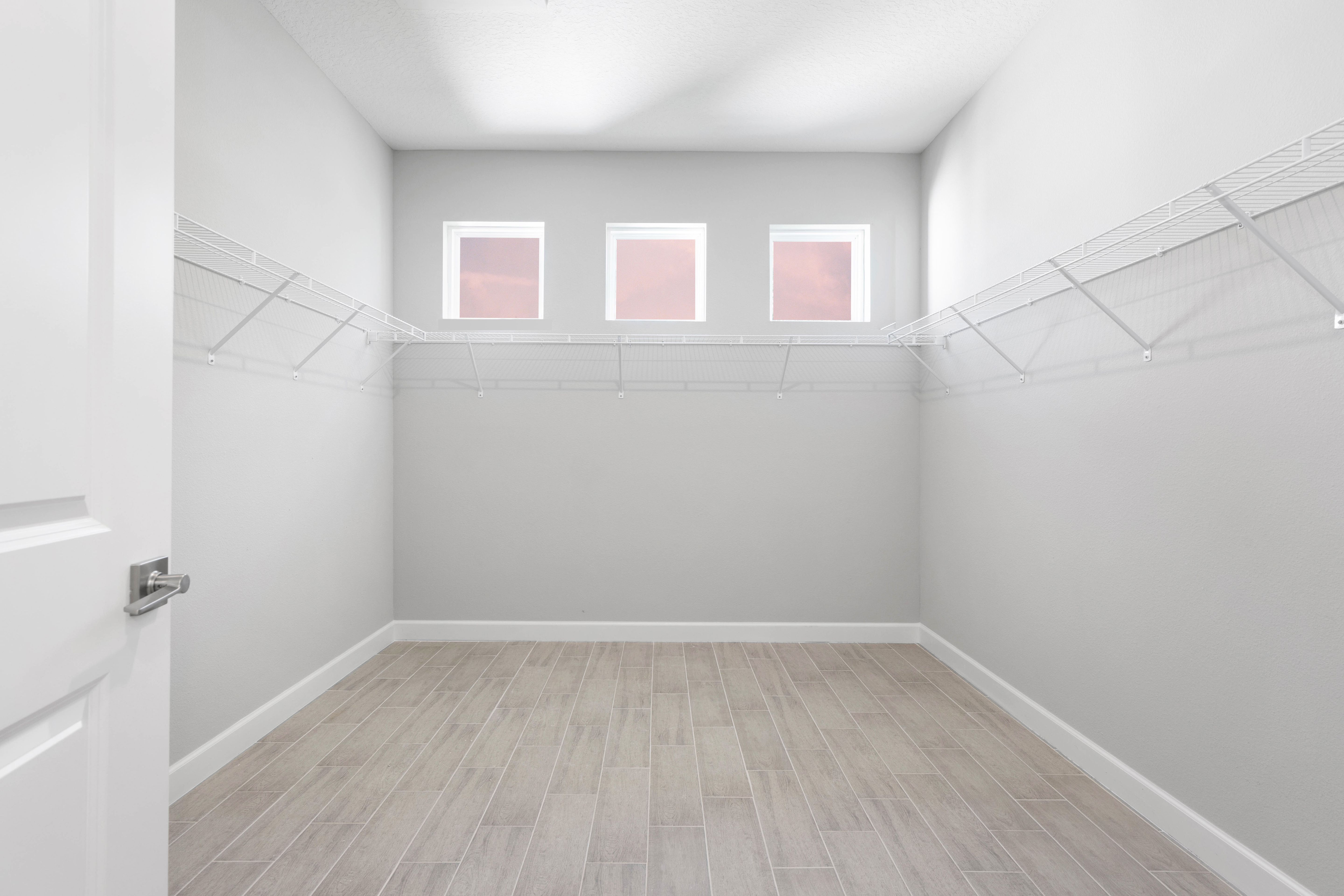 Enjoy the luxury of organization with this spacious Master Closet