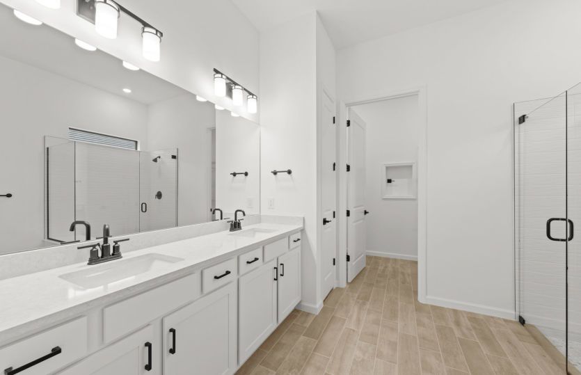 Owner's bathroom with dual sink vanity