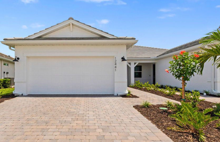 Welcoming exterior of this home with impact  glass windows