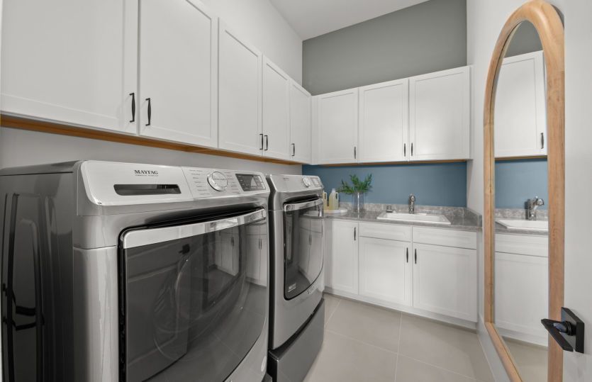 Laundry room with storage space