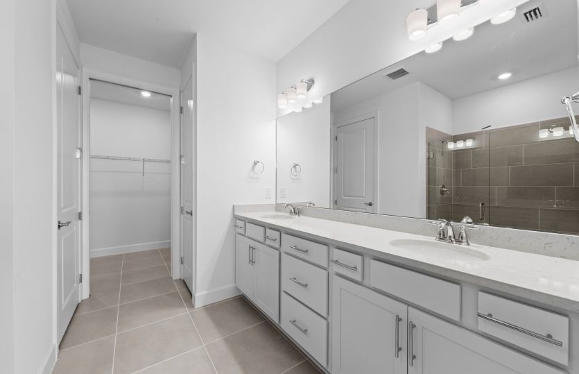 Owner's bathroom with dual sink vanity