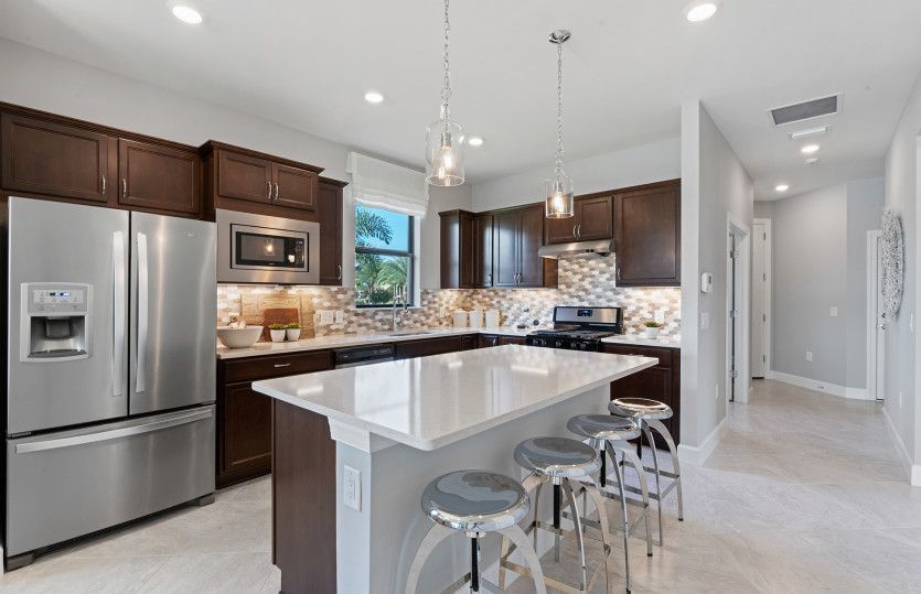 Kitchen with large center island and stainless steel appliances
