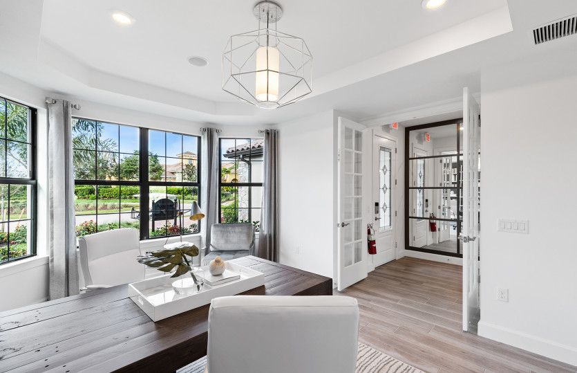 Enclosed flex space with bright window, perfect space for a home office or hobby room