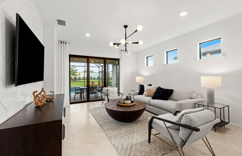 Sliding glass door leading to covered lanai and pool