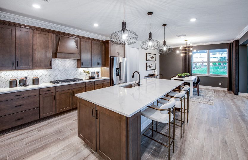 Oversized island in kitchen with designer finishes