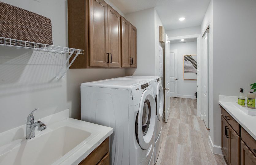 Spacious laundry room with optional sink and additional cabinets - perfect for storage