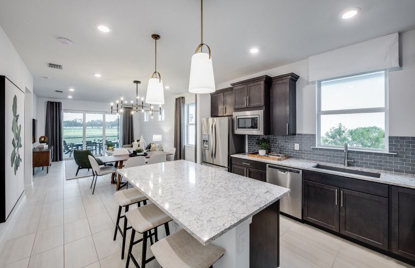Kitchen with large center island and stainless steel appliances