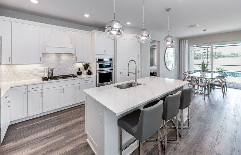 Gourmet kitchen with center island and stainless steel appliances