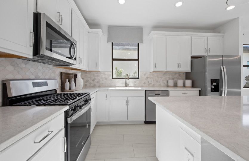 White kitchen cabinets and designer finishes