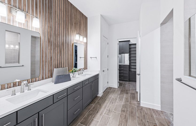 Owner's bathroom with dual sinks and optional garden tub