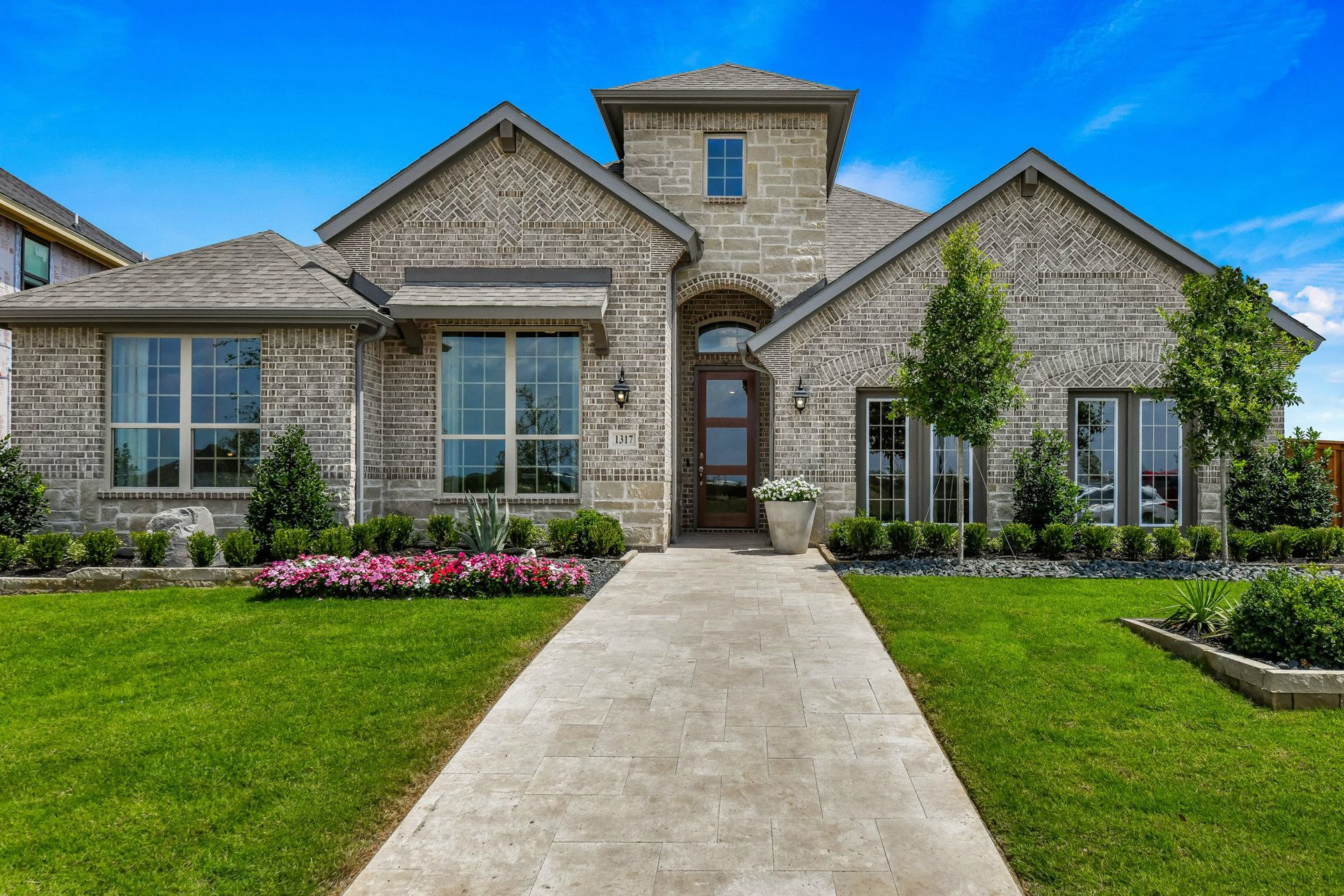 Plan 1685 Front Elevation Representative Photo by American Legend Homes