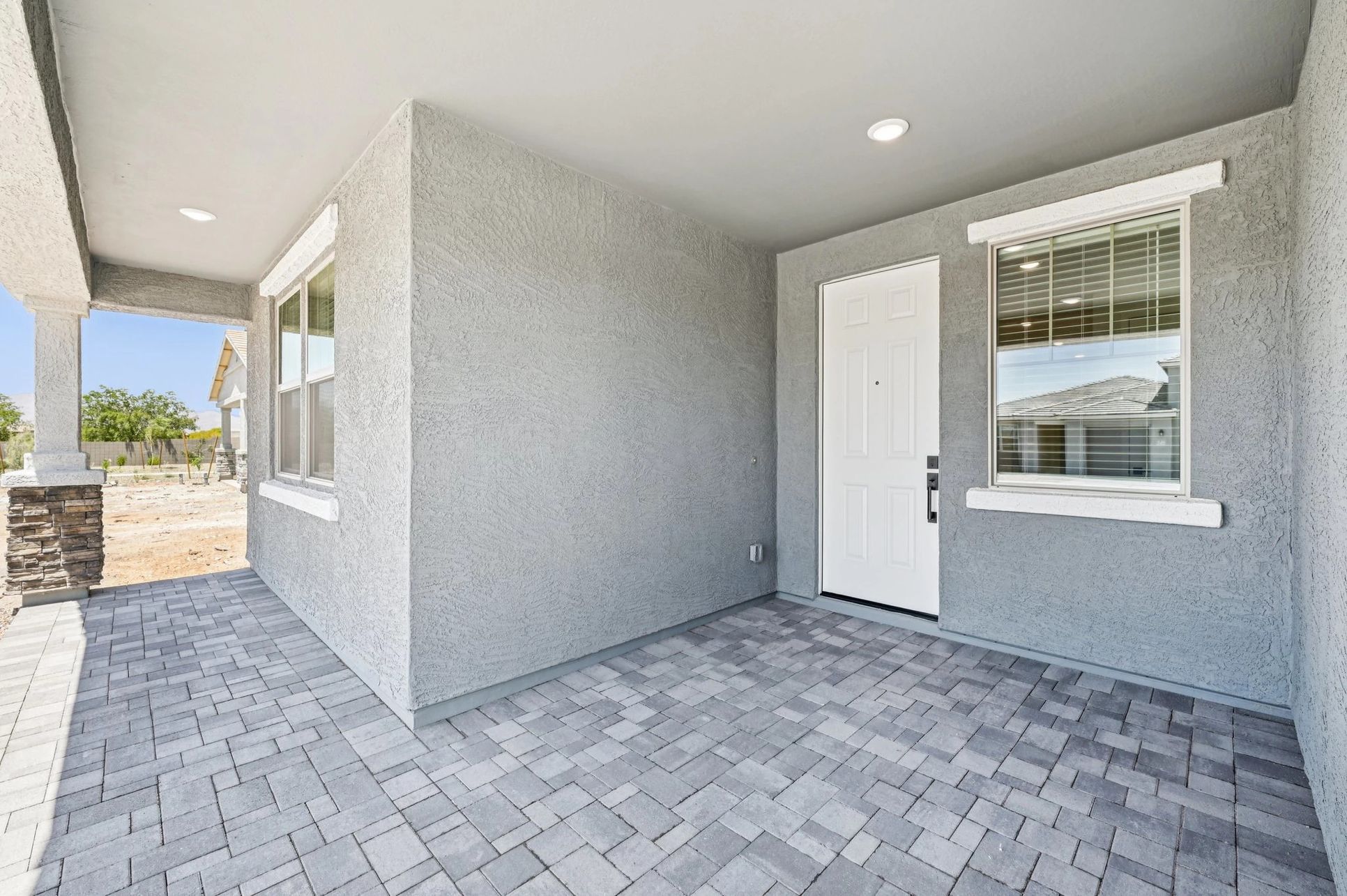 Exterior:Covered entry with pavers