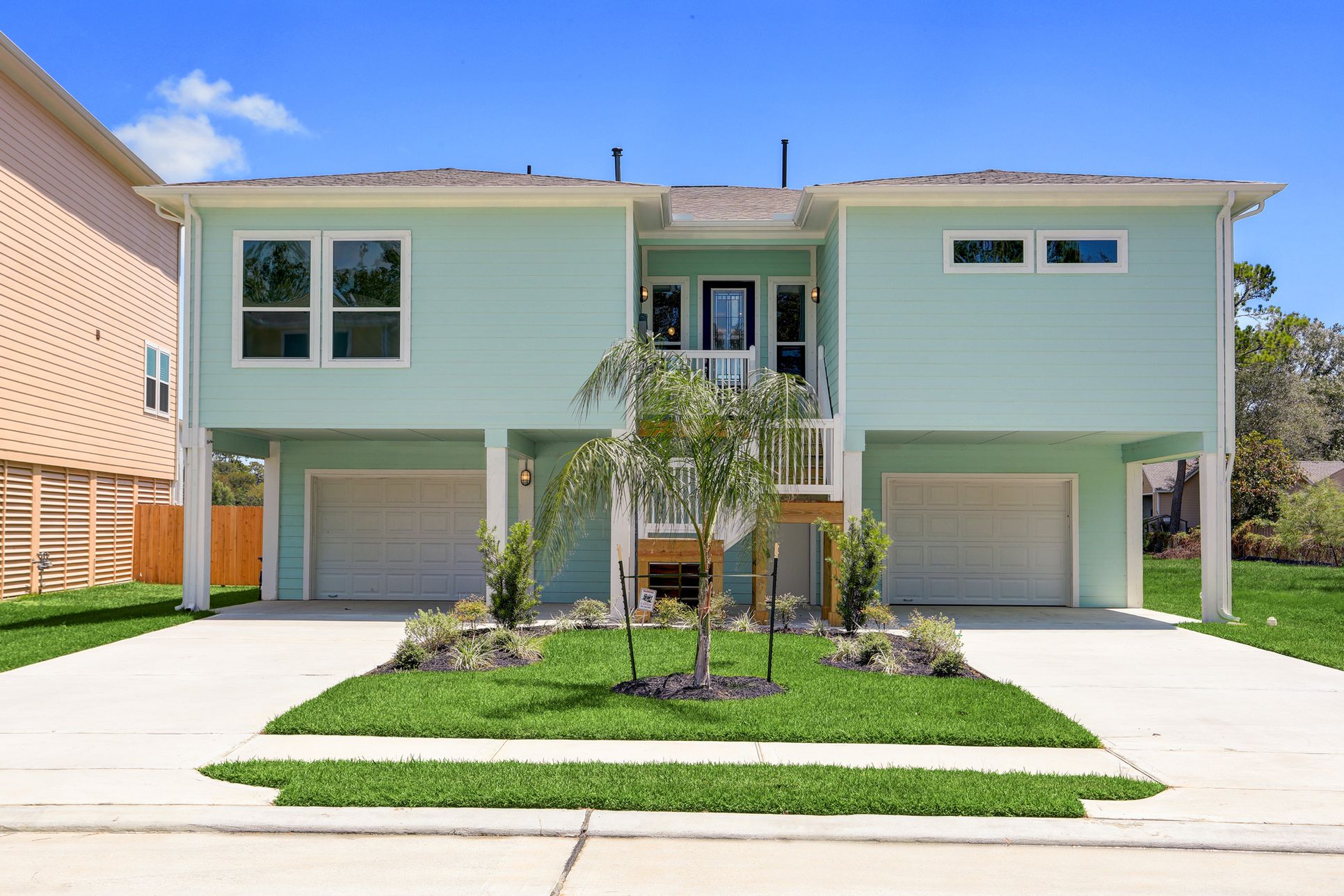 Front of the home with 3 car tandem garage