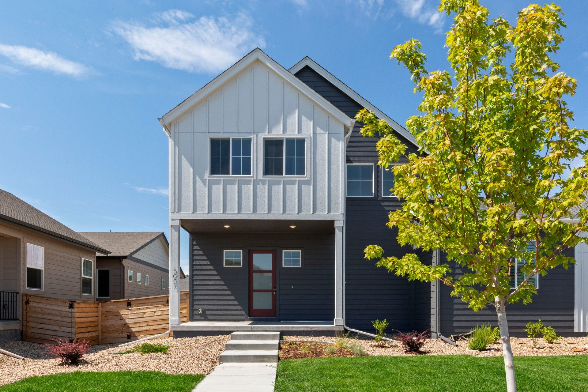 Modern Suburban House at Trailside on Harmony:Elegant mixed siding and sleek lines define this Trailside on Harmony residence.