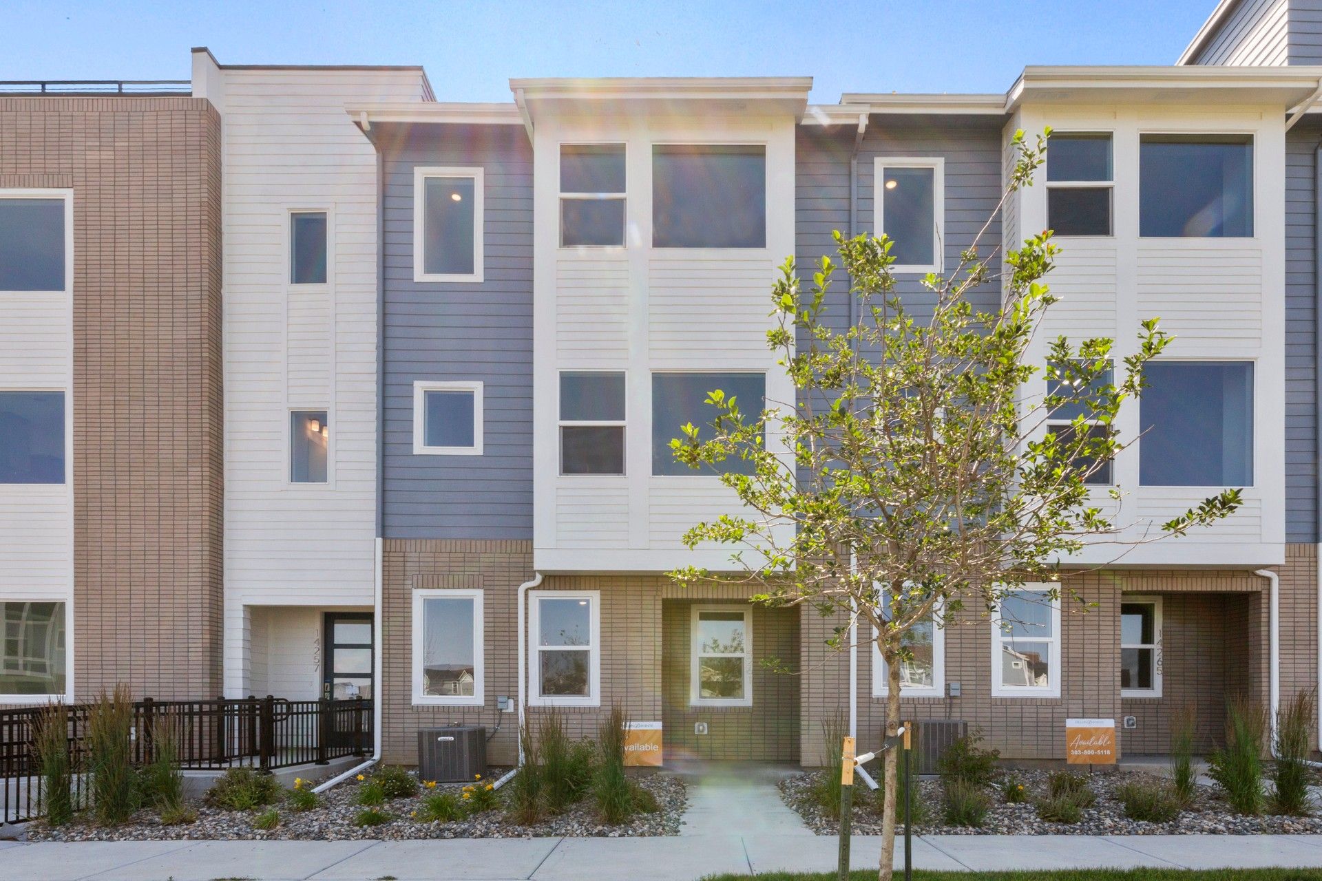 Modern Townhouse Exterior in Dillon Pointe:Exquisite facade with blend of brick and siding, sleek lines, ample windows in Dillon Pointe.