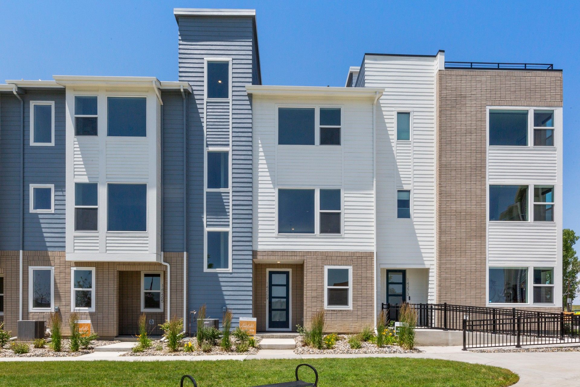 Columbia at Dillon Pointe Modern Townhomes:Sleek design with contrasting siding and expansive windows at Columbia at Dillon Pointe.