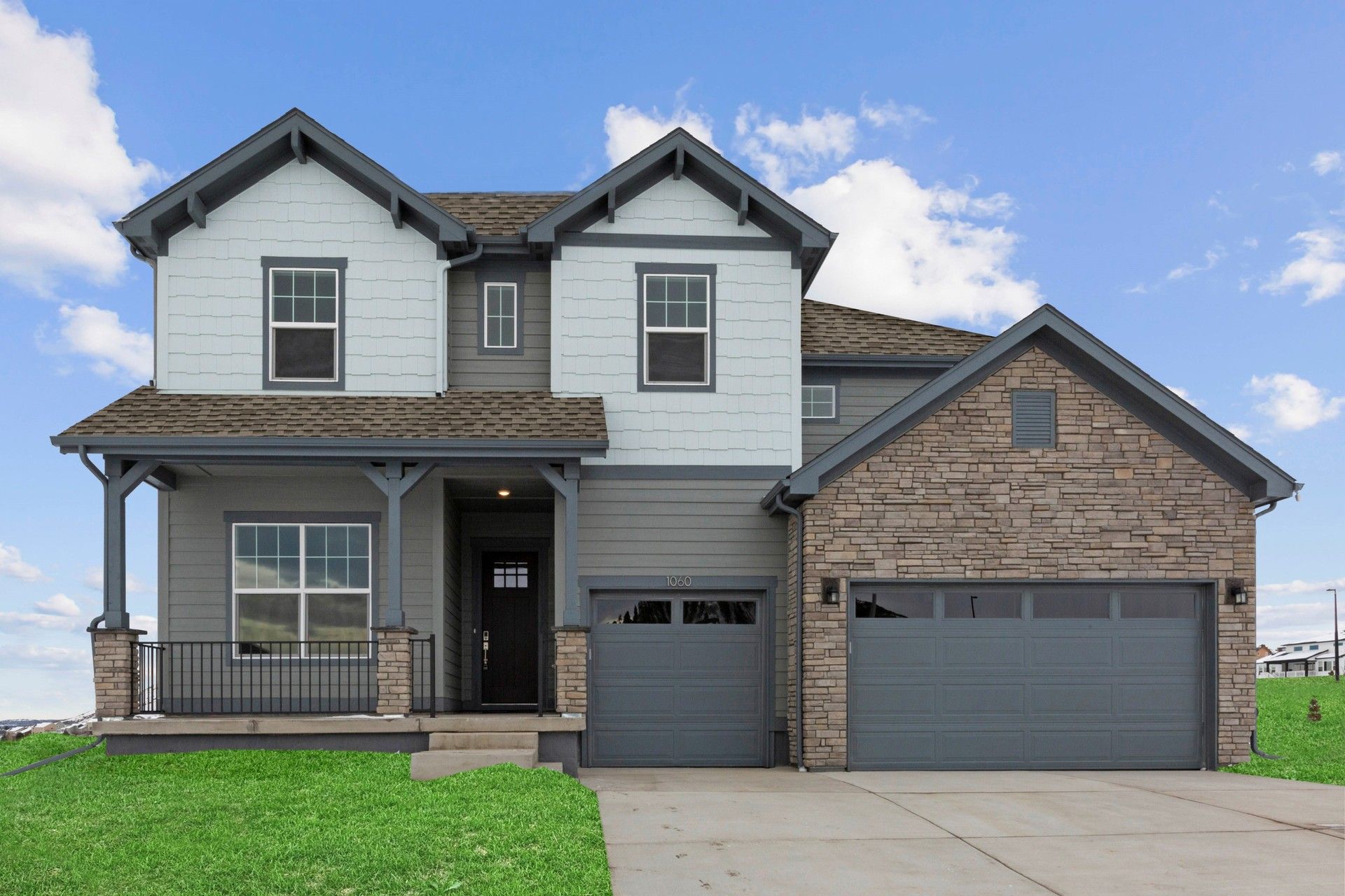 Elegant Two-Story Home in Montaine Community, Colorado:Experience refined living with gabled roofs and stone facade in Colorado's Montaine community.
