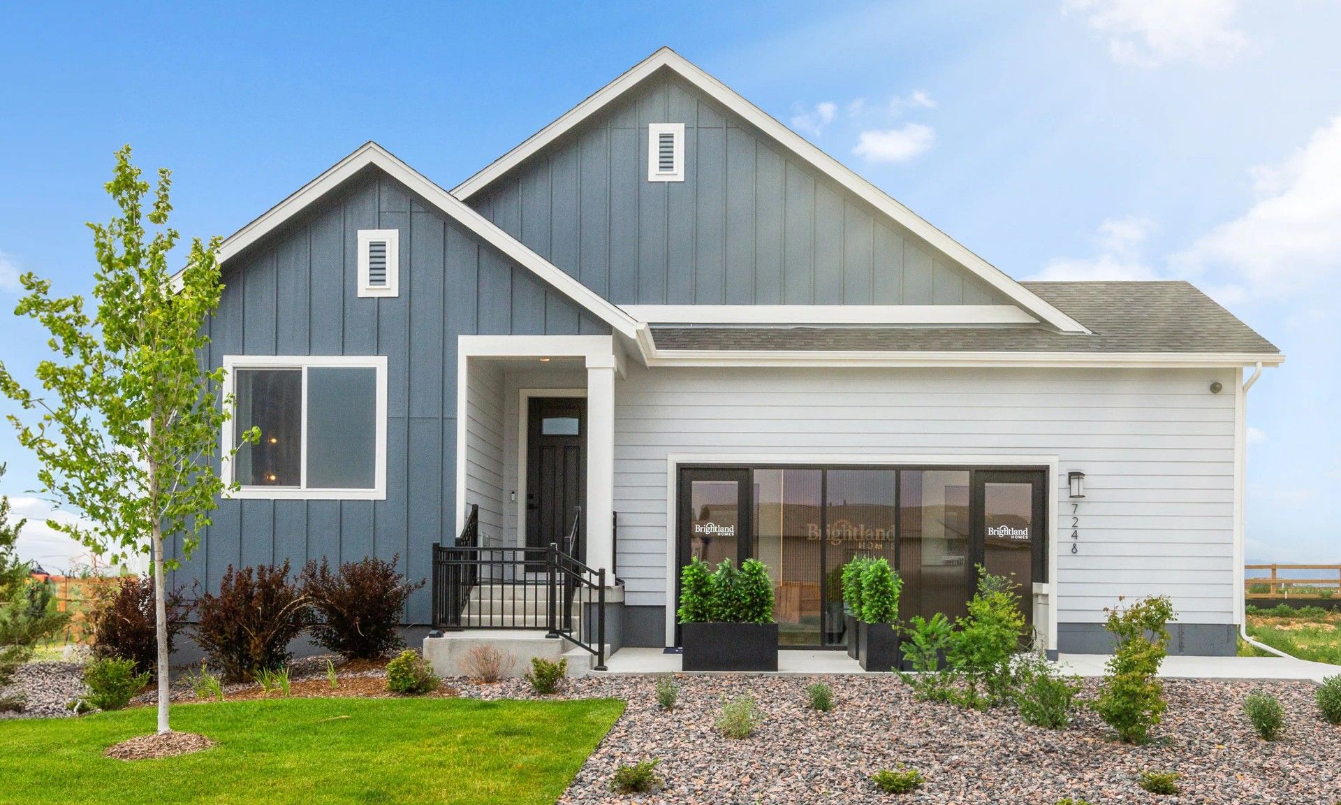Modern Suburban Home with Gabled Roof in Granary Community:Contemporary gabled design with sleek finishes in scenic Granary community. Meticulous landscaping enhances curb appeal.