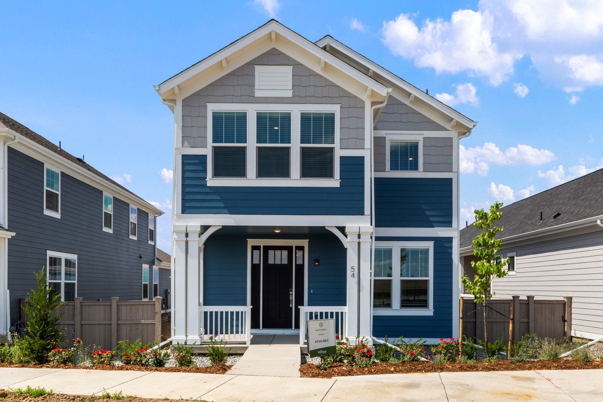 Two-story home at 54 Waterford Street in Westerly community with gabled roof:Elegant gabled roof and inviting front porch define this Westerly home at 54 Waterford Street.