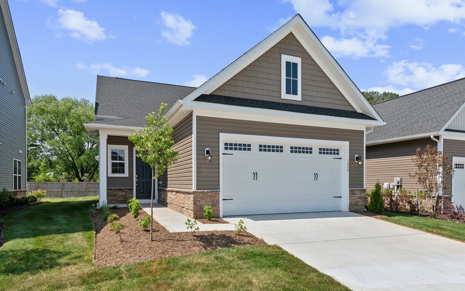 Exterior:The front exterior of the Douglas on homesite 1005 at Lakeside at Trappe.